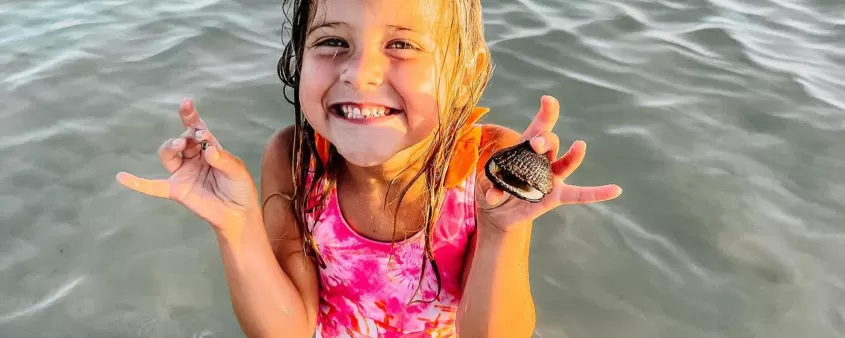 Girl with shells on Sanibel Island